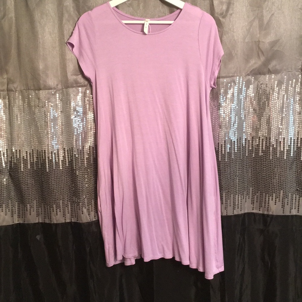 Short flowy dress.  No tag but never worn